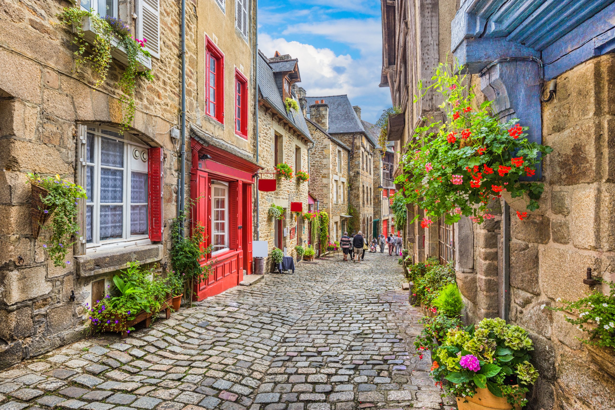 Idyllic scene of traditional houses in narrow alley in an old town in Europe